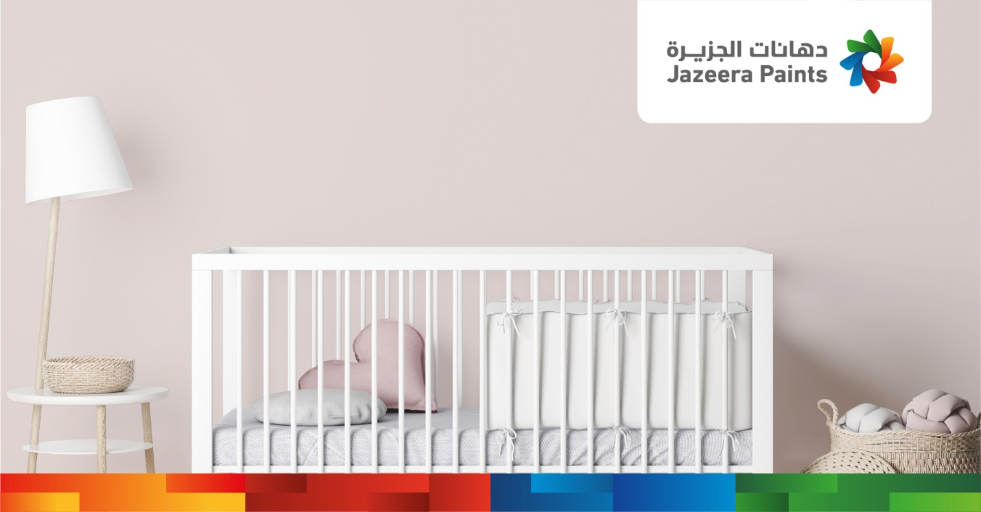 A crib with a white crib and colorful squares

Description automatically generated